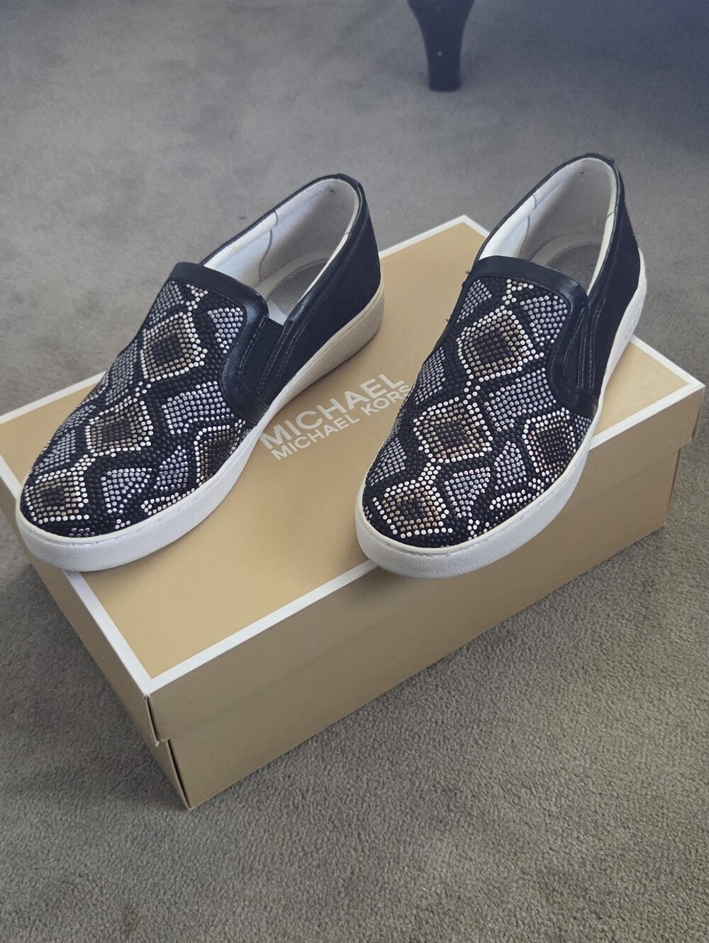 Michael Kors Black Slip-On Sneakers with White and Metallic Accents